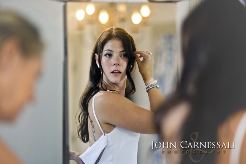 Bride touching her hair during wedding preparations