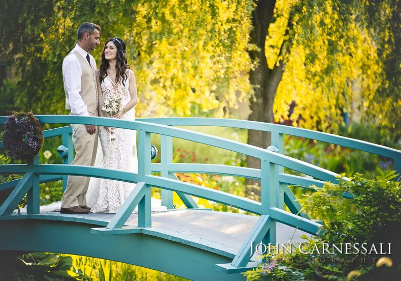 Couple on blue bridge at Mirbeau Inn and Spa