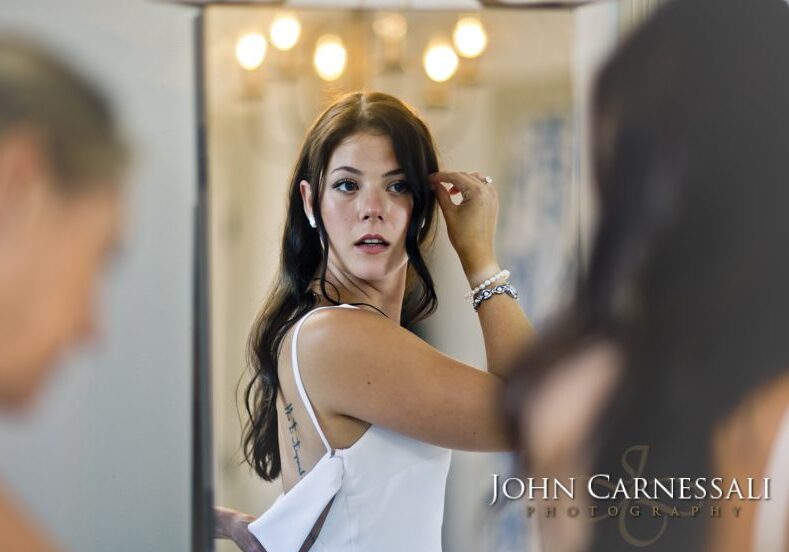 Bride touching her hair during wedding preparations