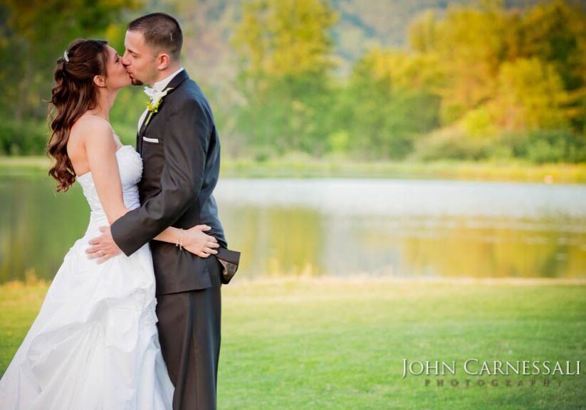 Bride and Groom Kissing at an Orchard Vali Wedding