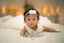 Infant baby crawling on soft blanket