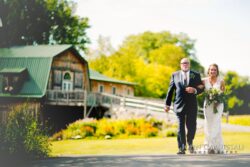 Wolf Oak Acres Wedding Bride and groom walking together outdoors at Wolf Oak Acres in Oneida NY