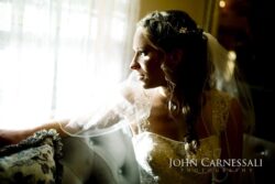 Wedding PHotography Bride sitting by a bright window in silhouette during getting ready at Wolf Oak Acres Oneida NY