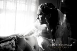 Wedding PHotography Bride leaning near a window in warm light during getting ready at Wolf Oak Acres Oneida NY