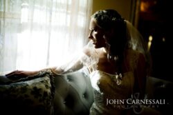 Getting ready portraits at Wolf Oak Acres—soft window light and timeless Central NY barn wedding photography. Bride sitting by a window in soft light during getting ready at Wolf Oak Acres Oneida NY