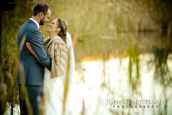 Upstate and Central NY barn wedding venue Close-up of bride and groom kissing outdoors with golden background at Wolf Oak Acres Oneida NY