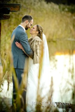 affordable outdoor wedding venue in Upstate and Central NY Bride and groom embracing in warm golden light at Wolf Oak Acres in Oneida NY
