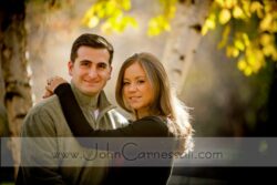 engagement photo of couple portrait close-up with warm fall leaves, Central NY