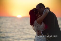 Bride and groom silhouette by the water at Bayshore Grove Oswego NY at sunset