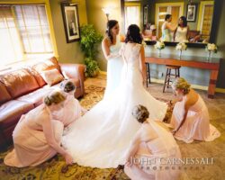 Bridesmaids helping with the dress at Bayshore Grove Oswego NY, Oswego wedding photographer