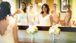 Bride and bridesmaids holding bouquets during getting ready at Bayshore Grove Oswego NY