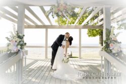 Romantic Bride and Groom Kiss at Bayshore Grove Wedding Venue in Oswego NY