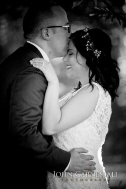 Bride and groom first dance under reception lighting at Bayshore Grove Oswego NY