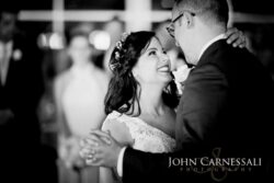 Black and white closeup smiling bride and groom