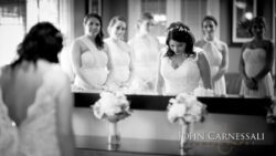 Bridesmaids helping with veil and hair at Bayshore Grove in Oswego NY, Oswego wedding photographer
