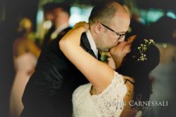 Groom dips bride for a kiss