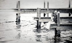 Wedding couple walking toward the lake at Belhurst Castle Geneva NY, Finger Lakes wedding photos by Seneca Lake