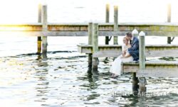 Bride and groom close-up portrait by the water at Belhurst Castle in Geneva NY, Finger Lakes wedding day