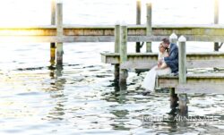 Wedding couple twirling by the lake at Belhurst Castle in Geneva NY, Seneca Lake Finger Lakes wedding day