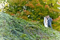 Bride and groom silhouette by the water at Belhurst Castle Geneva NY, Seneca Lake wedding portrait