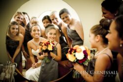 Bride and flower girl admiring bouquet