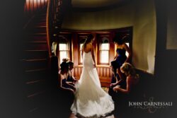 Bride getting ready in window light at Belhurst Castle Geneva NY, Finger Lakes wedding photography
