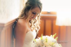 Bride reading a note during getting ready at Belhurst Castle Geneva NY, Finger Lakes wedding