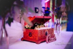 Ornate wooden box for cards at event.