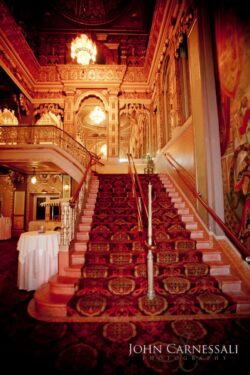 Wedding photography inside the Landmark Theatre in Syracuse NY showcasing elegant interior details.