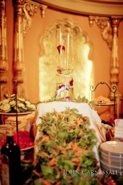 Elegant table setting with leafy centerpiece.