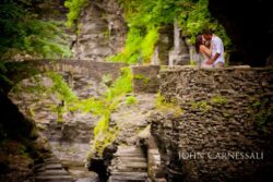 engagement photo of couple in front of rocky gorge or cliffside, adventurous Upstate NY engagement session