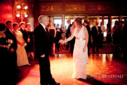 Bride and groom dancing at wedding reception.