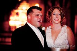 Couple smiling at a formal event.