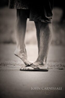 engagement photo of couple walking together holding hands, romantic candid couple portrait