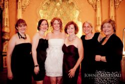 Group of six women in formal attire.