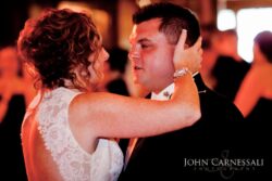 Dancing couple embracing at a formal event.