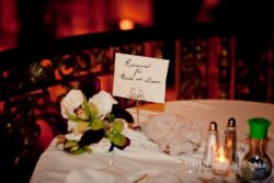 Reserved table with flowers and card.