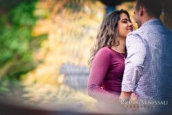 engagement photo of couple close-up with fall bokeh background, romantic candid couples portrait