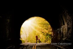 engagement photo silhouette in a glowing tunnel at golden hour