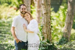 engagement photo of couple hugging near birch trees, bright natural light couples portrait