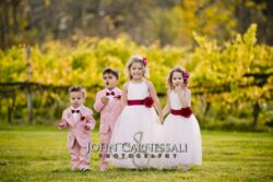 children dressed up and walking photojournalistic wedding photo