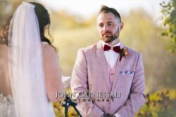 Bride and groom during outdoor wedding ceremony.