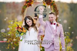 Bride and groom celebrating after just getting married at Owera Vineyards in Upstate NY