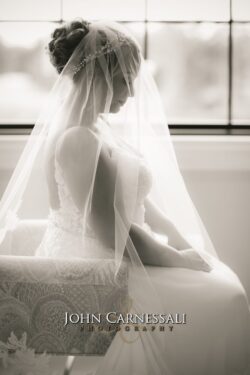 Wedding dress hanging indoors before the ceremony