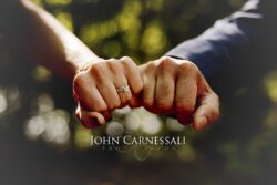engagement photo close-up of couple holding hands, romantic detail portrait in warm light