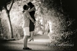 black and white engagement photo of couple kissing, romantic close-up couples portrait
