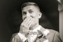 Groom smiling during wedding preparations