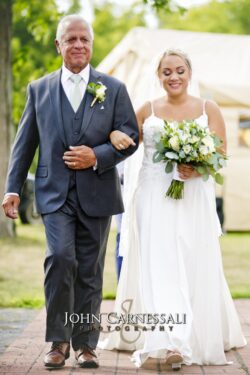 Bride and groom walking together outdoors