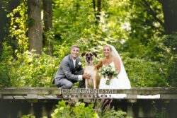Bride and groom sitting together on a bench