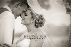 Black and white portrait of the bride in her veil